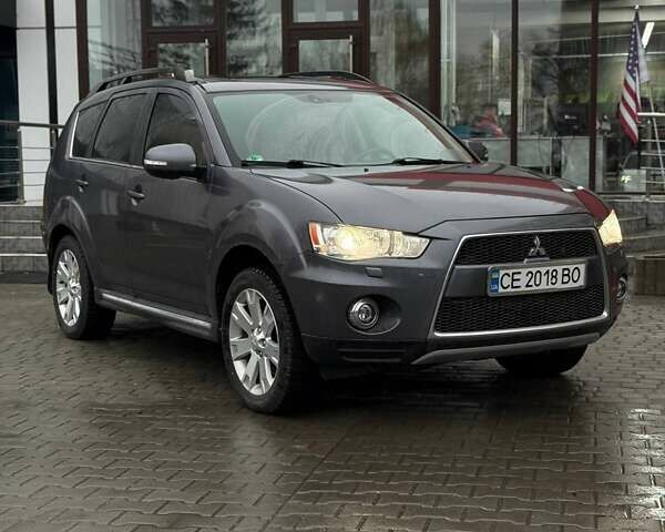 Серый Мицубиси Аутлендер, объемом двигателя 2.3 л и пробегом 160 тыс. км за 13900 $, фото 1 на Automoto.ua