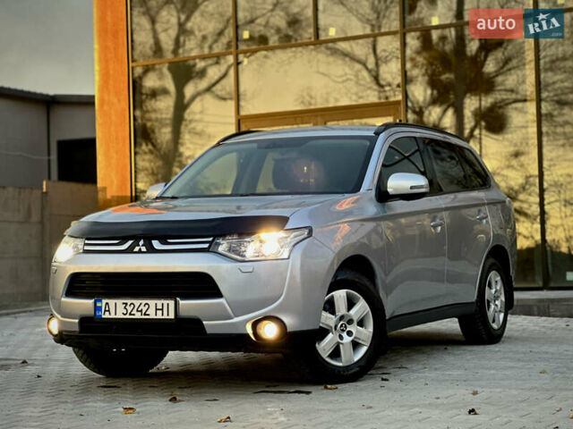Сірий Міцубісі Аутлендер, об'ємом двигуна 2.36 л та пробігом 225 тис. км за 10500 $, фото 1 на Automoto.ua
