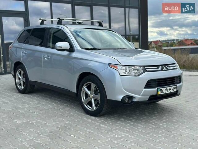 Серый Мицубиси Аутлендер, объемом двигателя 2.4 л и пробегом 228 тыс. км за 13999 $, фото 1 на Automoto.ua