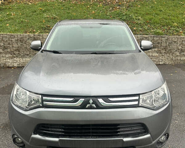 Сірий Міцубісі Аутлендер, об'ємом двигуна 2.4 л та пробігом 219 тис. км за 10800 $, фото 1 на Automoto.ua