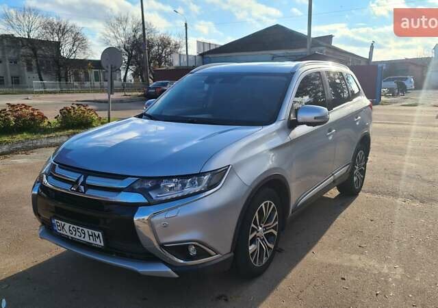 Серый Мицубиси Аутлендер, объемом двигателя 2.3 л и пробегом 253 тыс. км за 18500 $, фото 1 на Automoto.ua