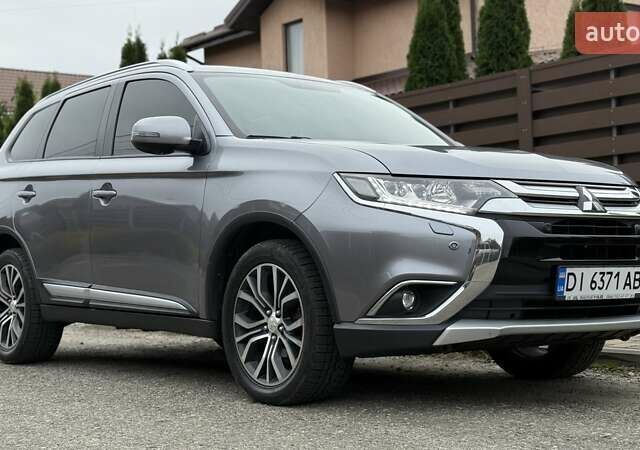 Серый Мицубиси Аутлендер, объемом двигателя 2.36 л и пробегом 153 тыс. км за 16950 $, фото 1 на Automoto.ua