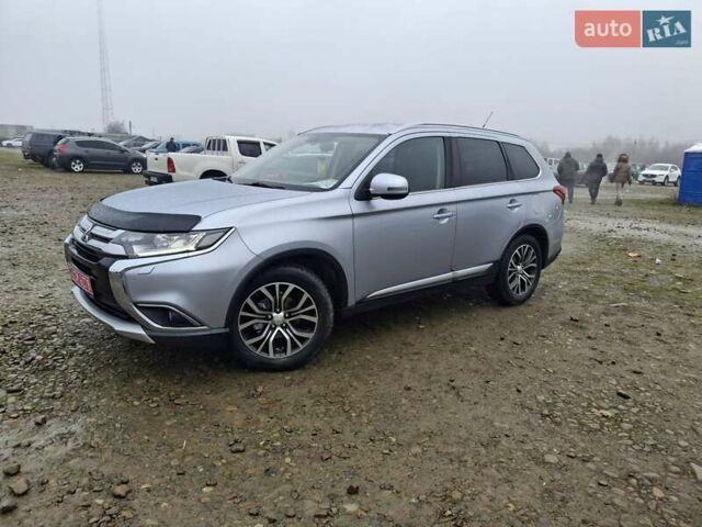 Серый Мицубиси Аутлендер, объемом двигателя 2.3 л и пробегом 205 тыс. км за 15999 $, фото 1 на Automoto.ua
