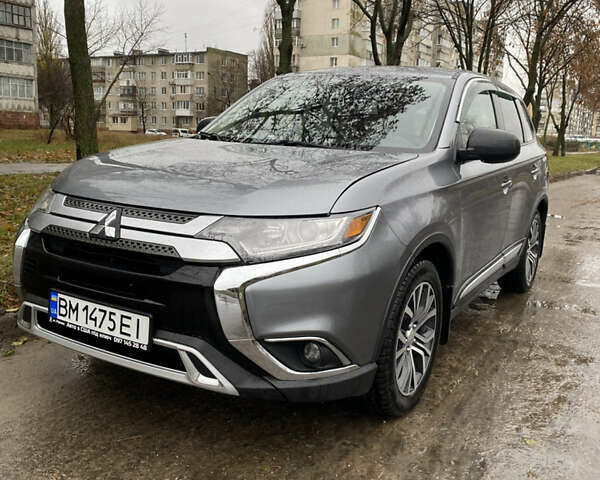 Серый Мицубиси Аутлендер, объемом двигателя 2.36 л и пробегом 150 тыс. км за 13500 $, фото 1 на Automoto.ua