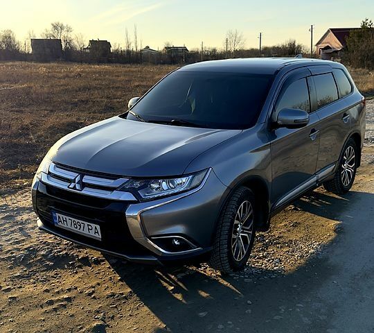 Серый Мицубиси Аутлендер, объемом двигателя 2.4 л и пробегом 125 тыс. км за 17200 $, фото 1 на Automoto.ua