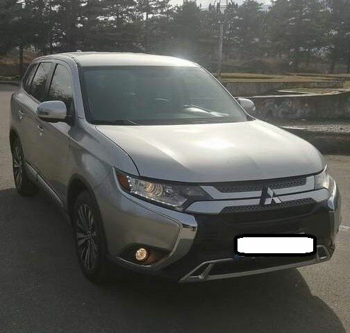 Серый Мицубиси Аутлендер, объемом двигателя 2.4 л и пробегом 91 тыс. км за 10599 $, фото 1 на Automoto.ua