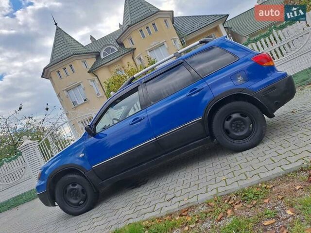 Синій Міцубісі Аутлендер, об'ємом двигуна 2.4 л та пробігом 234 тис. км за 4300 $, фото 1 на Automoto.ua