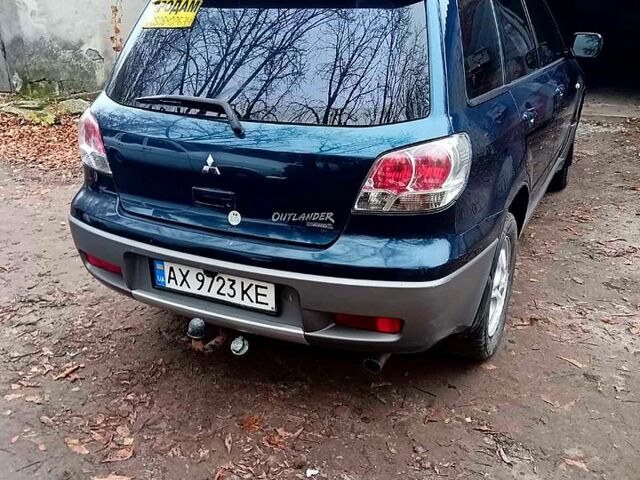 Синий Мицубиси Аутлендер, объемом двигателя 2 л и пробегом 195 тыс. км за 6500 $, фото 1 на Automoto.ua