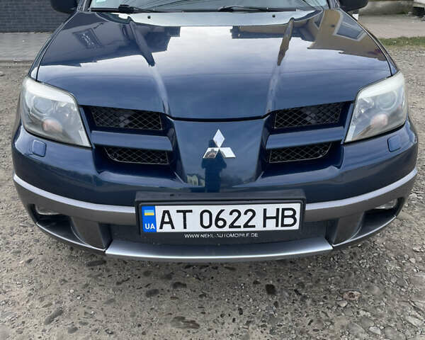 Синий Мицубиси Аутлендер, объемом двигателя 2 л и пробегом 231 тыс. км за 4900 $, фото 1 на Automoto.ua