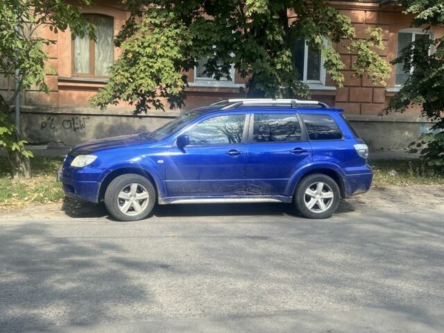 Синій Міцубісі Аутлендер, об'ємом двигуна 2.4 л та пробігом 256 тис. км за 6600 $, фото 1 на Automoto.ua