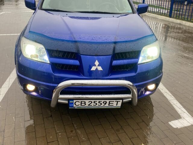Синий Мицубиси Аутлендер, объемом двигателя 2 л и пробегом 234 тыс. км за 5500 $, фото 1 на Automoto.ua