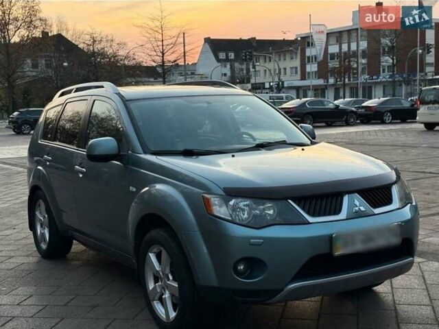 Синий Мицубиси Аутлендер, объемом двигателя 2.4 л и пробегом 207 тыс. км за 7800 $, фото 1 на Automoto.ua