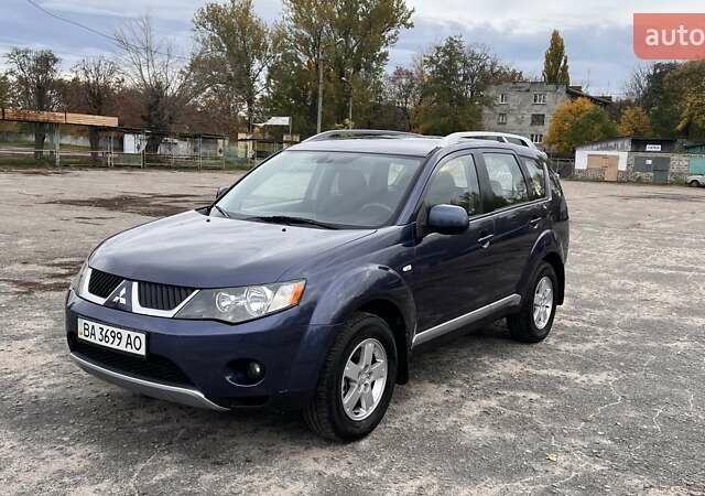 Синий Мицубиси Аутлендер, объемом двигателя 2.4 л и пробегом 94 тыс. км за 8800 $, фото 1 на Automoto.ua
