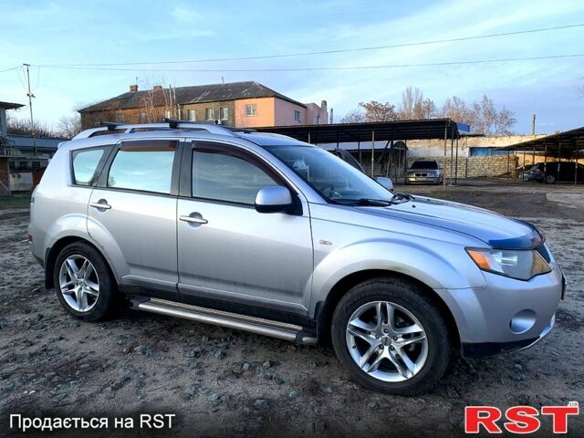 Синий Мицубиси Аутлендер, объемом двигателя 24 л и пробегом 205 тыс. км за 8300 $, фото 1 на Automoto.ua