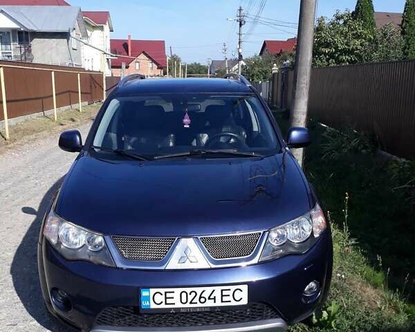 Синий Мицубиси Аутлендер, объемом двигателя 2.18 л и пробегом 205 тыс. км за 11000 $, фото 1 на Automoto.ua