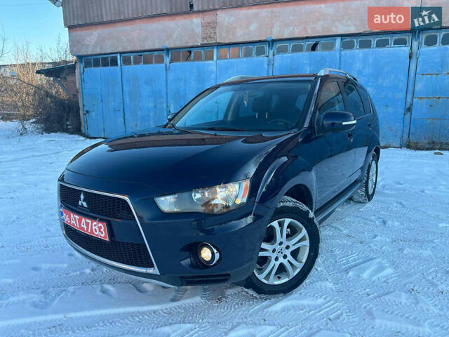 Синий Мицубиси Аутлендер, объемом двигателя 2 л и пробегом 252 тыс. км за 11500 $, фото 1 на Automoto.ua