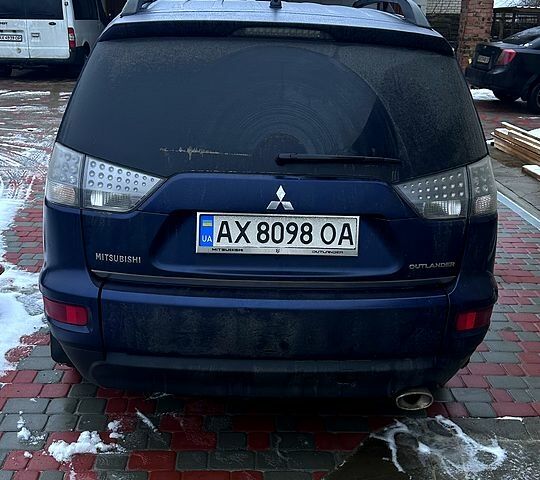 Синий Мицубиси Аутлендер, объемом двигателя 2.4 л и пробегом 250 тыс. км за 11800 $, фото 1 на Automoto.ua