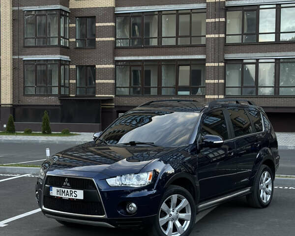 Синий Мицубиси Аутлендер, объемом двигателя 2.3 л и пробегом 232 тыс. км за 12300 $, фото 1 на Automoto.ua