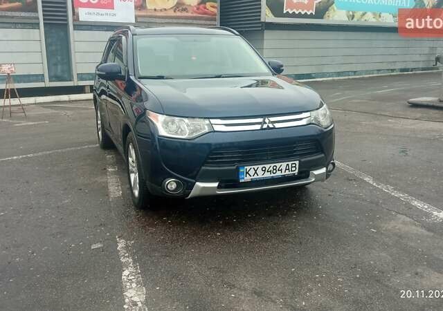 Синий Мицубиси Аутлендер, объемом двигателя 2.4 л и пробегом 230 тыс. км за 11300 $, фото 1 на Automoto.ua