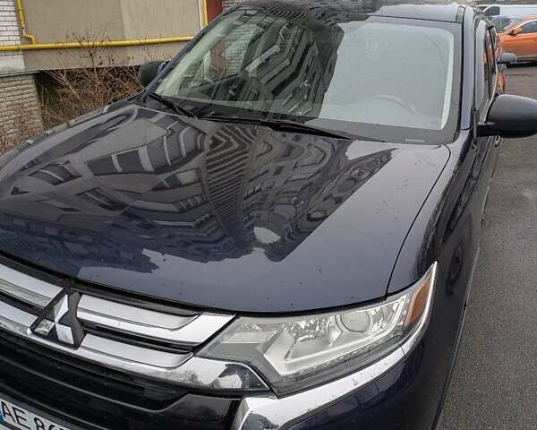 Синий Мицубиси Аутлендер, объемом двигателя 2.38 л и пробегом 136 тыс. км за 13000 $, фото 1 на Automoto.ua