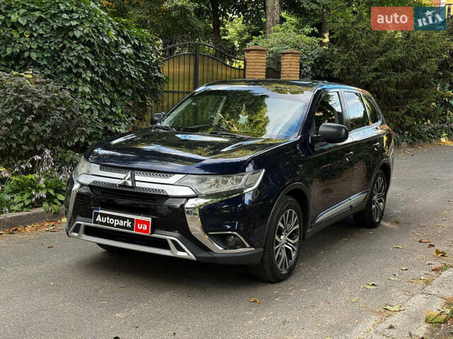 Синий Мицубиси Аутлендер, объемом двигателя 2.4 л и пробегом 144 тыс. км за 15490 $, фото 1 на Automoto.ua