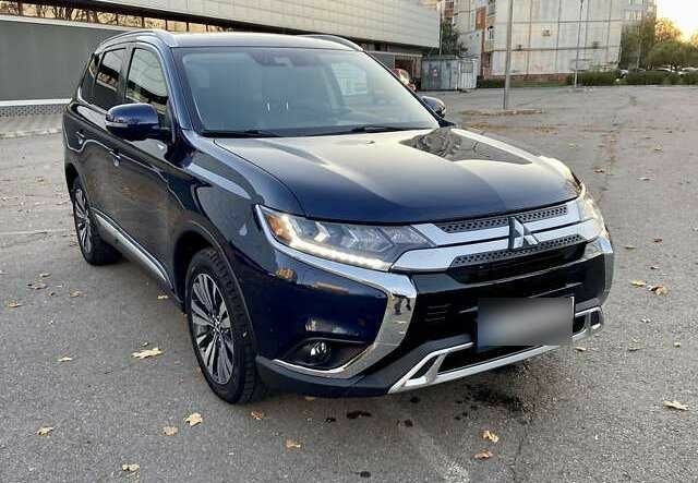 Синий Мицубиси Аутлендер, объемом двигателя 2.4 л и пробегом 71 тыс. км за 11800 $, фото 1 на Automoto.ua