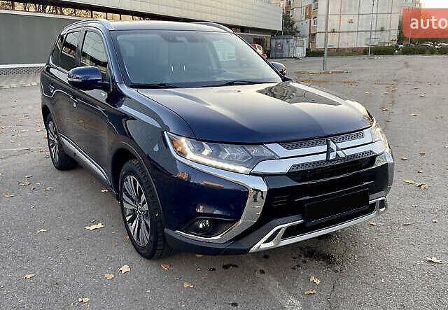 Синий Мицубиси Аутлендер, объемом двигателя 2.36 л и пробегом 71 тыс. км за 13800 $, фото 1 на Automoto.ua