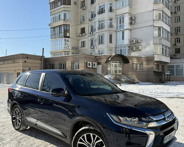 Синий Мицубиси Аутлендер, объемом двигателя 2.36 л и пробегом 96 тыс. км за 17700 $, фото 1 на Automoto.ua