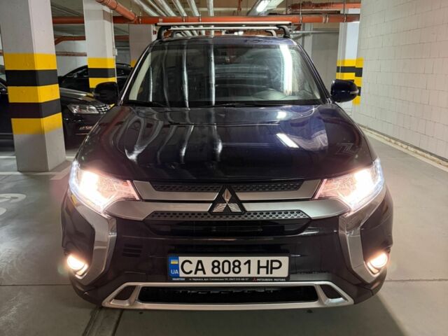 Синий Мицубиси Аутлендер, объемом двигателя 2 л и пробегом 128 тыс. км за 20000 $, фото 1 на Automoto.ua