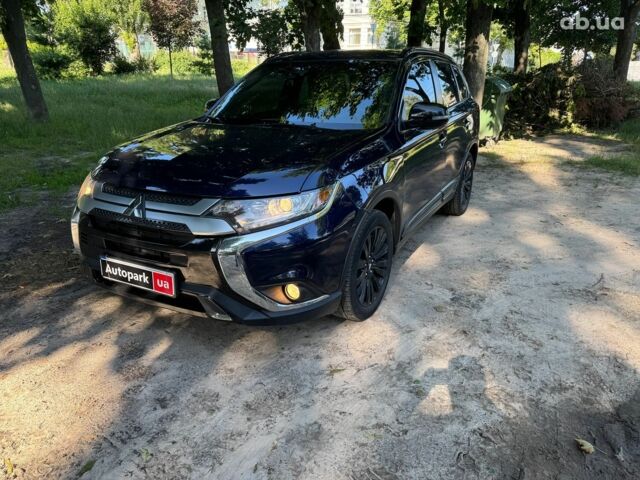 Синий Мицубиси Аутлендер, объемом двигателя 2.4 л и пробегом 75 тыс. км за 15990 $, фото 1 на Automoto.ua