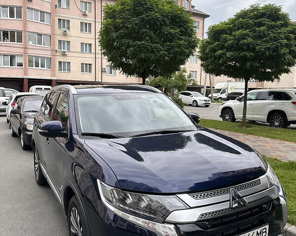 Синий Мицубиси Аутлендер, объемом двигателя 2.36 л и пробегом 47 тыс. км за 34000 $, фото 1 на Automoto.ua