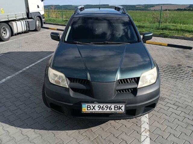 Зелений Міцубісі Аутлендер, об'ємом двигуна 2 л та пробігом 173 тис. км за 5400 $, фото 1 на Automoto.ua