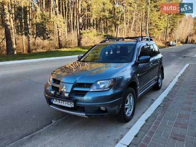 Зелений Міцубісі Аутлендер, об'ємом двигуна 2 л та пробігом 370 тис. км за 4800 $, фото 1 на Automoto.ua
