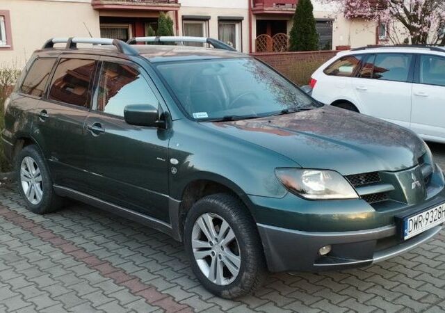 Зеленый Мицубиси Аутлендер, объемом двигателя 2.4 л и пробегом 226 тыс. км за 3500 $, фото 1 на Automoto.ua