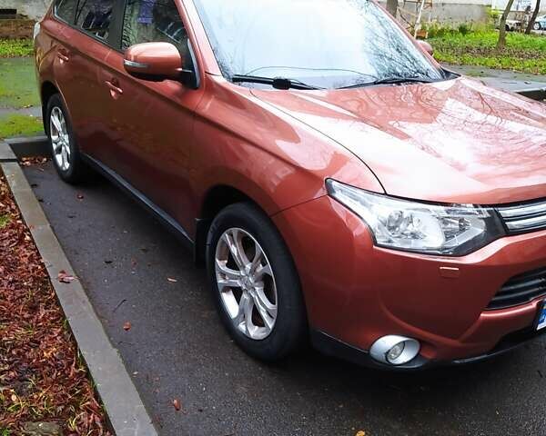 Помаранчевий Міцубісі Аутлендер, об'ємом двигуна 2.4 л та пробігом 166 тис. км за 11700 $, фото 1 на Automoto.ua