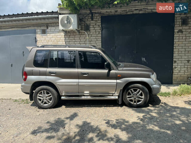 Бежевий Міцубісі Паджеро Пінін, об'ємом двигуна 2 л та пробігом 237 тис. км за 6000 $, фото 1 на Automoto.ua