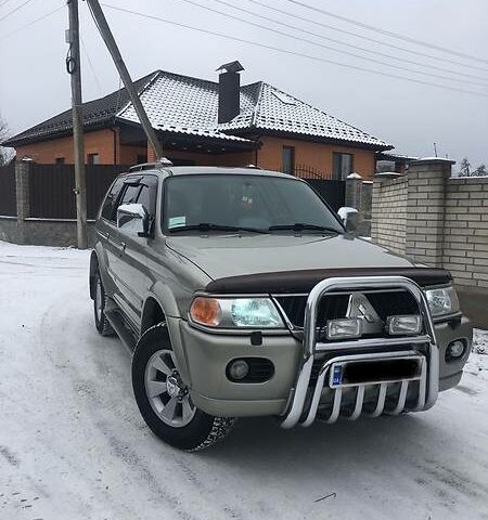 Бежевий Міцубісі Паджеро Спорт, об'ємом двигуна 3 л та пробігом 230 тис. км за 10700 $, фото 1 на Automoto.ua