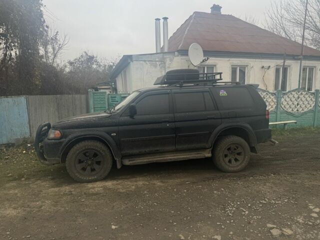 Черный Мицубиси Паджеро Спорт, объемом двигателя 3 л и пробегом 340 тыс. км за 6000 $, фото 1 на Automoto.ua