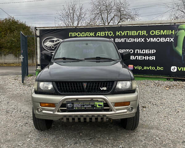 Черный Мицубиси Паджеро Спорт, объемом двигателя 3 л и пробегом 280 тыс. км за 6800 $, фото 1 на Automoto.ua