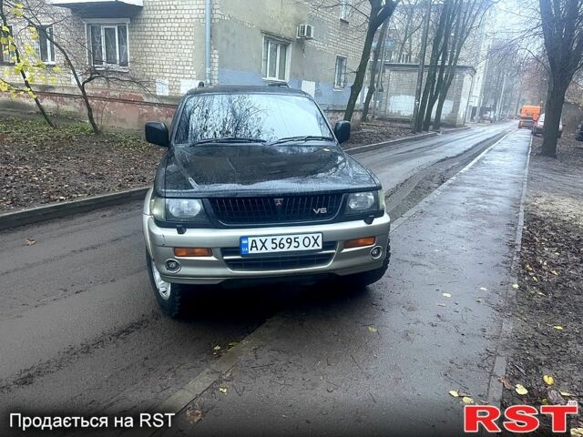 Чорний Міцубісі Паджеро Спорт, об'ємом двигуна 3 л та пробігом 185 тис. км за 6500 $, фото 1 на Automoto.ua