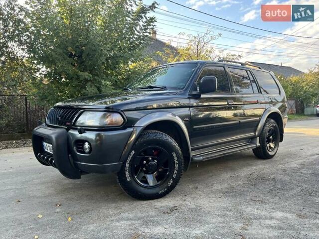 Черный Мицубиси Паджеро Спорт, объемом двигателя 3 л и пробегом 430 тыс. км за 9777 $, фото 1 на Automoto.ua