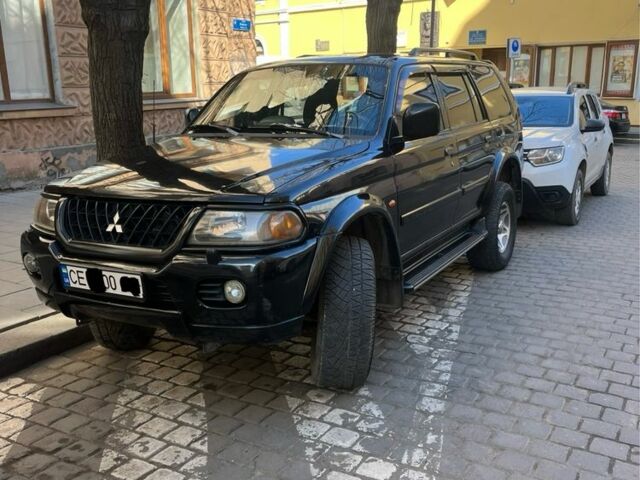 Чорний Міцубісі Паджеро Спорт, об'ємом двигуна 3 л та пробігом 313 тис. км за 6900 $, фото 1 на Automoto.ua