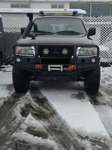 Черный Мицубиси Паджеро Спорт, объемом двигателя 3 л и пробегом 370 тыс. км за 10500 $, фото 1 на Automoto.ua