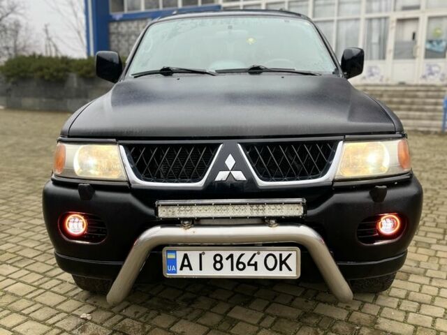 Чорний Міцубісі Паджеро Спорт, об'ємом двигуна 3 л та пробігом 200 тис. км за 5500 $, фото 1 на Automoto.ua