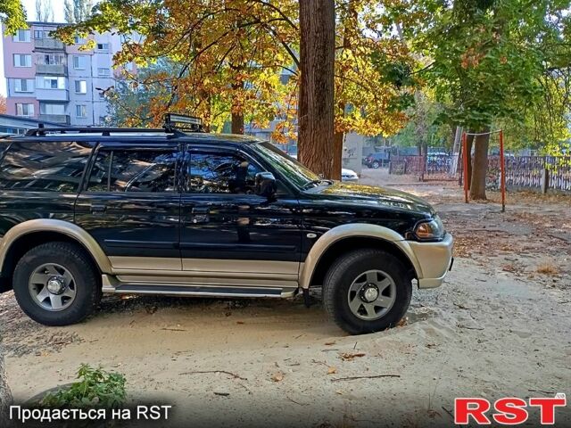 Чорний Міцубісі Паджеро Спорт, об'ємом двигуна 3 л та пробігом 180 тис. км за 8200 $, фото 1 на Automoto.ua