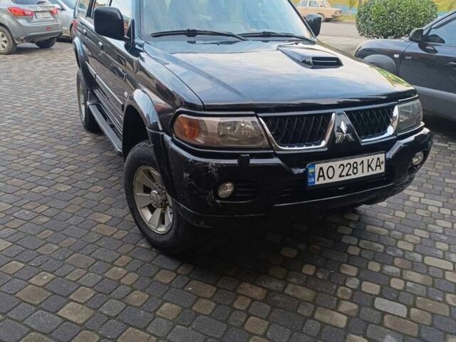 Чорний Міцубісі Паджеро Спорт, об'ємом двигуна 2.5 л та пробігом 275 тис. км за 9300 $, фото 1 на Automoto.ua