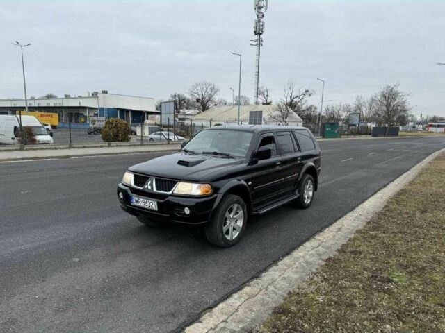 Чорний Міцубісі Паджеро Спорт, об'ємом двигуна 2.5 л та пробігом 248 тис. км за 4100 $, фото 1 на Automoto.ua