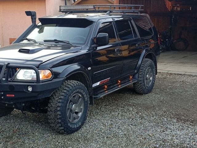 Чорний Міцубісі Паджеро Спорт, об'ємом двигуна 2.5 л та пробігом 279 тис. км за 13000 $, фото 1 на Automoto.ua