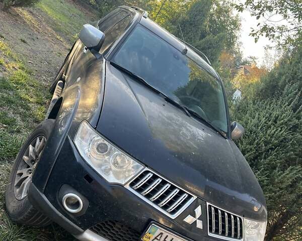 Черный Мицубиси Паджеро Спорт, объемом двигателя 2.5 л и пробегом 320 тыс. км за 12000 $, фото 1 на Automoto.ua