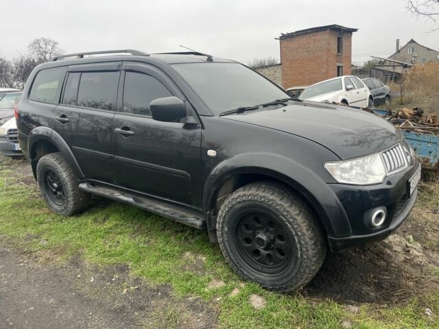 Черный Мицубиси Паджеро Спорт, объемом двигателя 2.5 л и пробегом 199 тыс. км за 10000 $, фото 1 на Automoto.ua